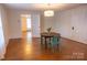 Bright dining room featuring hardwood floors and vintage table set at 35 E Catawba St, Belmont, NC 28012