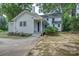 Side view of white home with green landscape, flowers and steps at 35 E Catawba St, Belmont, NC 28012