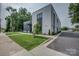 Modern commercial building with sleek design, well-manicured lawn, and ample parking at 35 E Catawba St, Belmont, NC 28012