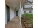 Classic two-story home with a covered front porch and mature landscaping at 35 E Catawba St, Belmont, NC 28012