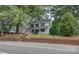 Two-story home with front porch and lush landscaping at 35 E Catawba St, Belmont, NC 28012