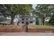 Charming two-story home with a classic facade, front porch, and lush green surroundings at 35 E Catawba St, Belmont, NC 28012