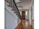 Charming foyer featuring hardwood floors and a traditional wood door at 35 E Catawba St, Belmont, NC 28012