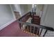 Staircase features hardwood floors, carpeted stairs, and a railing at 35 E Catawba St, Belmont, NC 28012