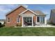 Charming backyard featuring a pergola-covered patio, brick accents and an open grassy lawn, ideal for outdoor enjoyment at 403 Garner Dr, Salisbury, NC 28146
