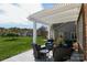 Spacious backyard patio with cozy seating under a pergola, ideal for outdoor gatherings and relaxation at 403 Garner Dr, Salisbury, NC 28146