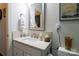 Cozy bathroom featuring a sink vanity, warm lighting, and white walls at 403 Garner Dr, Salisbury, NC 28146