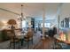 Inviting dining room with hardwood floors, chandelier, wainscotting and open floor plan at 403 Garner Dr, Salisbury, NC 28146