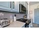 Modern kitchen featuring white countertops, light blue cabinets, and stainless steel appliances at 403 Garner Dr, Salisbury, NC 28146