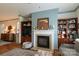 Fireplace with decorative mantle flanked by built-in shelving in this living room at 403 Garner Dr, Salisbury, NC 28146