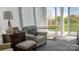 Bright sunroom featuring large windows, a comfortable chair, and neutral tones at 403 Garner Dr, Salisbury, NC 28146