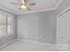 Neutral bedroom featuring a ceiling fan, a large window with blinds, and access to a closet at 4038 City Homes Pl, Charlotte, NC 28209