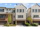Charming townhome showcasing a modern architectural design, beautiful landscaping, and an attached two-car garage at 4038 City Homes Pl, Charlotte, NC 28209