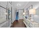 Elegant foyer with hardwood floors, a staircase with a blue runner, and stylish decor enhancing the entry at 4038 City Homes Pl, Charlotte, NC 28209