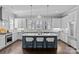 Well-equipped kitchen with stainless steel appliances, expansive island, and stylish pendant lighting at 4038 City Homes Pl, Charlotte, NC 28209