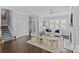 Open-concept living room leading to staircase, featuring fireplace and hardwood flooring at 4038 City Homes Pl, Charlotte, NC 28209