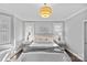 Bright main bedroom with luxury rug, plantation shutters, and stylish decor at 4038 City Homes Pl, Charlotte, NC 28209