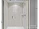 Modern shower with light tile, glass door, and a sleek design for a spa-like bathroom experience at 4038 City Homes Pl, Charlotte, NC 28209