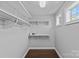 Walk-in closet features custom shelving and ample storage space at 4038 City Homes Pl, Charlotte, NC 28209