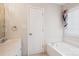 Bright bathroom with white tub, vanity, framed mirror, and a combo bath and shower at 4608 Mabry Pkwy, Rock Hill, SC 29732