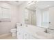 Bright bathroom featuring a double sink vanity, large mirror, and plentiful natural light from a large window at 4608 Mabry Pkwy, Rock Hill, SC 29732