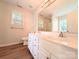 Bathroom with a double sink vanity, a large mirror and vinyl floors at 4608 Mabry Pkwy, Rock Hill, SC 29732