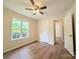 Neutral-toned bedroom features hardwood floors, a ceiling fan, and two doorways at 4608 Mabry Pkwy, Rock Hill, SC 29732