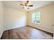Well-lit bedroom features hardwood floors, a ceiling fan, and a window providing natural light at 4608 Mabry Pkwy, Rock Hill, SC 29732