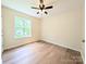 Bright bedroom featuring hardwood floors, a ceiling fan, and a window that brings in natural light at 4608 Mabry Pkwy, Rock Hill, SC 29732