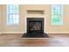 Living room featuring a fireplace and ample natural light from the windows at 4608 Mabry Pkwy, Rock Hill, SC 29732