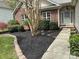 Inviting brick home with a manicured front yard, walkway, and garden beds filled with black mulch at 4608 Mabry Pkwy, Rock Hill, SC 29732