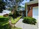 Charming front yard featuring a brick home, walkway, and a variety of shrubs and plants at 4608 Mabry Pkwy, Rock Hill, SC 29732