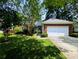 Well-manicured front yard of a brick home featuring a two-car garage and decorative landscaping at 4608 Mabry Pkwy, Rock Hill, SC 29732