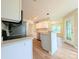 Open kitchen with white cabinets, stainless steel appliances, and breakfast nook at 4608 Mabry Pkwy, Rock Hill, SC 29732