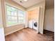 Well-lit laundry room featuring a washing machine with a folding door at 4608 Mabry Pkwy, Rock Hill, SC 29732
