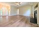 Open living room showcasing hardwood floors, vaulted ceilings, a fireplace, and ample natural light at 4608 Mabry Pkwy, Rock Hill, SC 29732