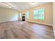 Open living room featuring vaulted ceilings, modern flooring, large windows, and a corner fireplace at 4608 Mabry Pkwy, Rock Hill, SC 29732