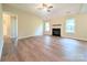 Bright living room with hardwood floors, a cozy fireplace, large windows and vaulted ceilings at 4608 Mabry Pkwy, Rock Hill, SC 29732