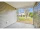 Covered patio offering a view of the spacious backyard, featuring a shed, lawn, and mature trees at 4608 Mabry Pkwy, Rock Hill, SC 29732