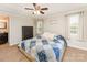 Cozy bedroom with ceiling fan, wooden accents, and plenty of natural light at 4767 Stratford Ln, Denver, NC 28037