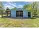 Large blue outbuilding with open door and covered area at 4767 Stratford Ln, Denver, NC 28037