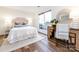 Bright bedroom featuring a desk area, natural light, and minimalist decor at 5007 Sharon Rd # S, Charlotte, NC 28210