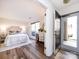 Bedroom with wood floors and an open doorway leading to the entrance at 5007 Sharon Rd # S, Charlotte, NC 28210
