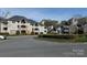 Condo community featuring landscaped grounds and a decorative water feature at 5007 Sharon Rd # S, Charlotte, NC 28210