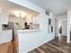 Cozy kitchen features white cabinetry, stainless appliances, and breakfast bar at 5007 Sharon Rd # S, Charlotte, NC 28210