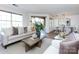 Bright and airy living room with access to the dining area and outdoor patio at 5007 Sharon Rd # S, Charlotte, NC 28210