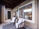 Inviting patio with stylish seating, large windows, and neutral tones, creating a relaxing outdoor living space at 5007 Sharon Rd # S, Charlotte, NC 28210
