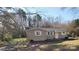 Charming single-story home featuring a welcoming front yard on a sunny day at 5628 Anderson Rd, Charlotte, NC 28269