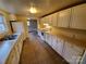Traditional kitchen with laminate countertops, and view of the dining area at 5628 Anderson Rd, Charlotte, NC 28269