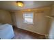Well-lit laundry room featuring a new washer and ample storage at 5628 Anderson Rd, Charlotte, NC 28269